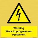 warning-work-in-progress-on-equipmentwith-electrical-hazard-symbol~